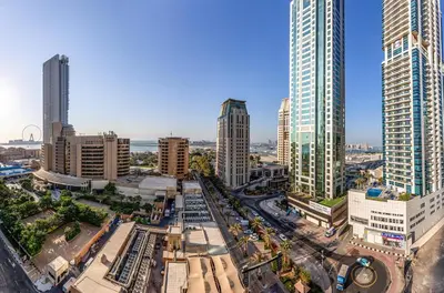an aerial view of a city with tall buildings at Sea View Studio 10min from beach Royal Oceanic in Dubai