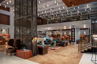a lobby of a store with couches and chairs at DoubleTree by Hilton Dubai M Square Hotel & Residences in Dubai