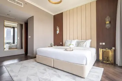 a bedroom with a large white bed in a room at Frank Porter - Burj Vista in Dubai