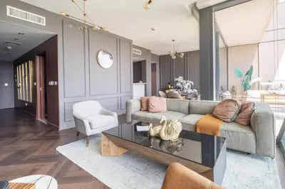a living room with a couch and a table at Frank Porter - Burj Vista in Dubai