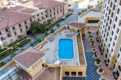 an overhead view of a building with a swimming pool at Huge Sea View Studio in Murjan JBR in Dubai