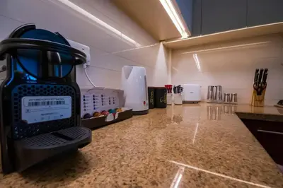 a kitchen counter with a blender on top of it at Modern 2BR with Balcony Sea Views and Pool, Gym Near Attractions in Dubai