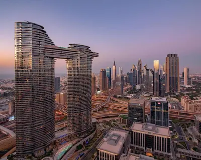 a view of a city skyline with a tall building at Modern 2BR with Balcony Sea Views and Pool, Gym Near Attractions in Dubai