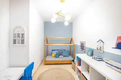 a childs room with a bed and a desk at Nasma Luxury Stays- Majestic Marina Views, Lavish 4BR Getaway in JBR in Dubai