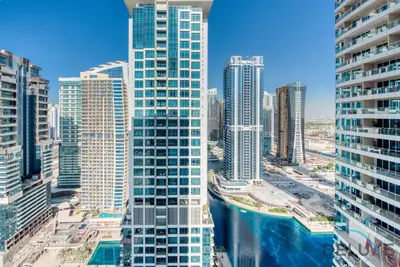 an aerial view of a city with tall buildings at Next to Lake 2BR Apartment Accessible to Metro, Dubai Gate 2, Jumeirah Lake Towers by Deluxe Holiday Homes in Dubai