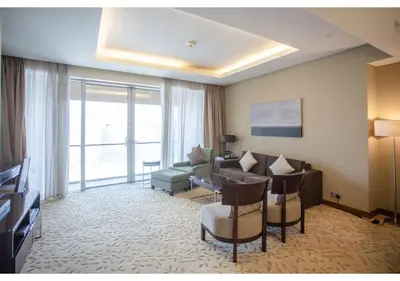 a living room with a couch and a table at Dubai Mall Residences -Luxury 1 bedroom in Dubai