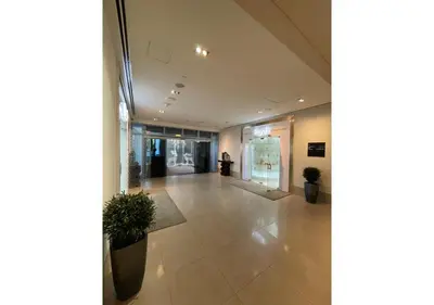 an empty lobby with plants in a building at Dubai Mall Residences -Luxury 1 bedroom in Dubai