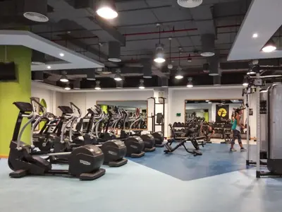 a gym with treadmills and cardio equipment in it at The Smart Concierge - Bahar 1 in Dubai