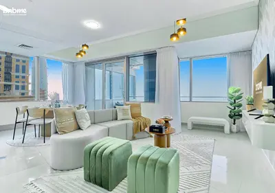 a living room with a couch and a table at bnbme - Dubai Marina 54th Floor Apt Sea View Two Balconies Pool Gym & Parking in Dubai