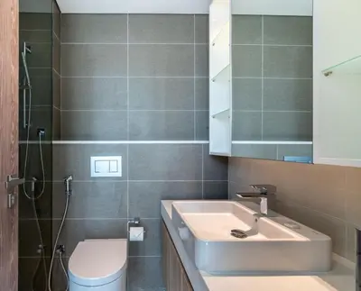 a bathroom with a sink and a toilet at GuestReady Holiday Homes - A Sigh of Bliss in Dubai