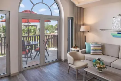 a living room with a couch and a table at JA Palm Tree Court, Dubai in Dubai