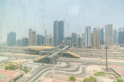 a view of a city with tall buildings and a highway at skynest homes studio in JLT in Dubai