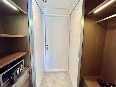 a closet with a white door in a room at Fashion Avenue Dubai Mall Residences - Studio with balcony in Dubai