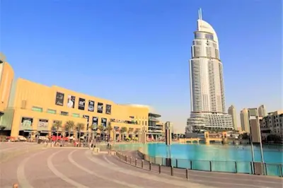 a city with a tall building in the background at Fashion Avenue Dubai Mall Residences - Studio with balcony in Dubai