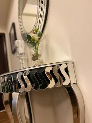 a mirror sitting on top of a metal chair at Luxury 1br in Dubai Marina, ask for July Full month offer in Dubai