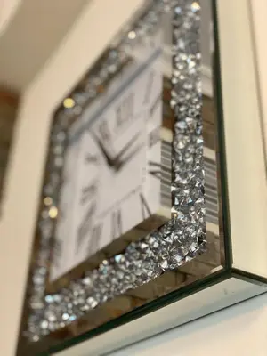 a reflection of a clock in a mirror at Luxury 1br in Dubai Marina, ask for July Full month offer in Dubai