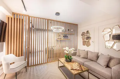 a living room with a couch and a table at Nasma Luxury Stays - Boulevard Central Tower in Dubai