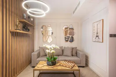 a living room with a couch and a table at Nasma Luxury Stays - Boulevard Central Tower in Dubai