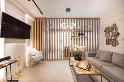 a living room with a couch and a table at Nasma Luxury Stays - Boulevard Central Tower in Dubai