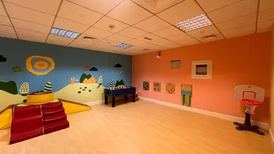 a kids room with a basketball hoop and a basketball court at FIRST CLASS 3BR Burj Khalifa & Fountain View in Dubai