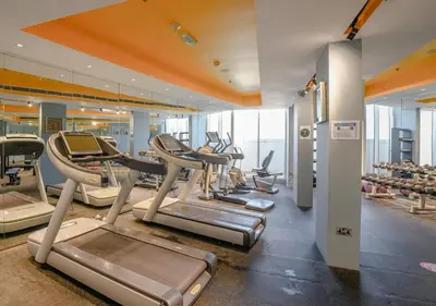 a gym with a bunch of cardio equipment in a building at City Stay Residences - Serviced Apartments Al Barsha in Dubai