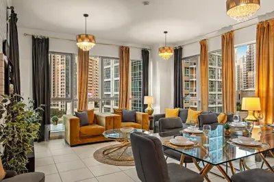 a living room with furniture and large windows at FIRST CLASS 1BR Spectacular Fountain Views in Dubai