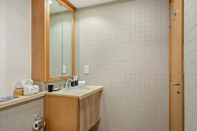 a bathroom with a sink and a mirror at FIRST CLASS 1BR Spectacular Fountain Views in Dubai