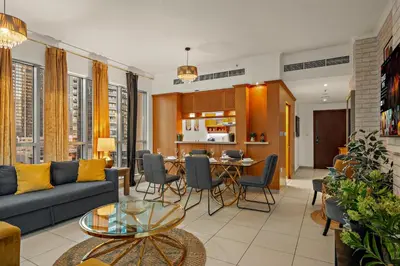 a living room with a couch and a table at FIRST CLASS 1BR Spectacular Fountain Views in Dubai