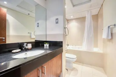 a bathroom with a sink and a toilet at Prime Retreats - Downtown Dubai in Dubai