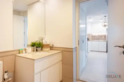 a bathroom with a sink and a mirror at Blissful 1BR in Safi Town Square by Deluxe Holiday Homes in Dubai