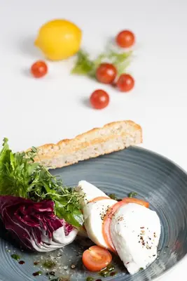 a plate of food with meat and vegetables on it at ABAR HOTEL APARTMENTS DIP-1 in Dubai