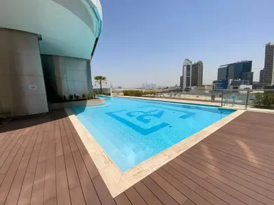 a swimming pool on the roof of a building at RH- Downtown Oasis, Spacious 01 BR in Downtown near Dubai Mall in Dubai