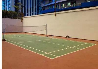 a tennis court with a net on top of it at RH- A Stylish Home Away from Home, Spacious 02 BR near Dubai Mall in Dubai