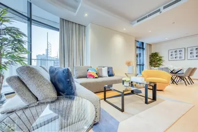 a living room with a couch and a table at RH- Upscale Living in the Heart of the City, 02BR, Near Dubai Mall in Dubai