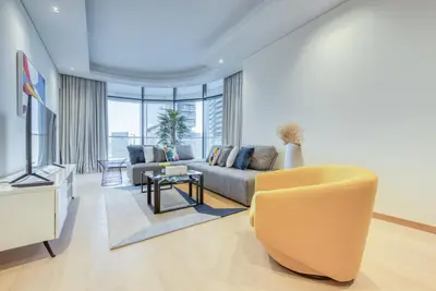 a living room with a couch and a table at RH- Upscale Living in the Heart of the City, 02BR, Near Dubai Mall in Dubai