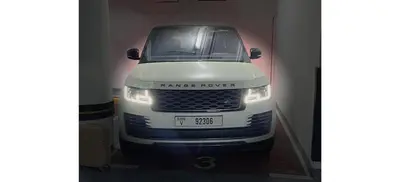 a white van is parked in a room at Luxurious 4-Bedroom Duplex VILLA Apartment near JBR in Dubai
