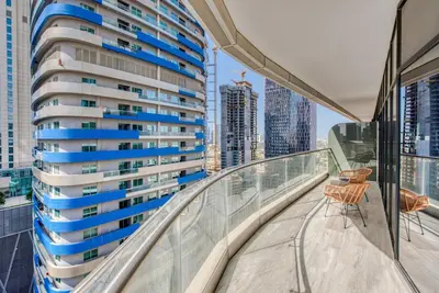 a balcony with a view of a tall building at RH- Downtown Delight, Chic 01BR near Dubai Mall & Burj Khalifa, RP Heights in Dubai