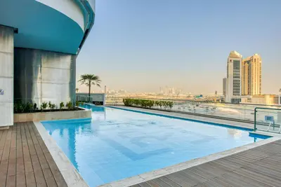 a swimming pool on the roof of a building at RH- Downtown Delight, Chic 01BR near Dubai Mall & Burj Khalifa, RP Heights in Dubai