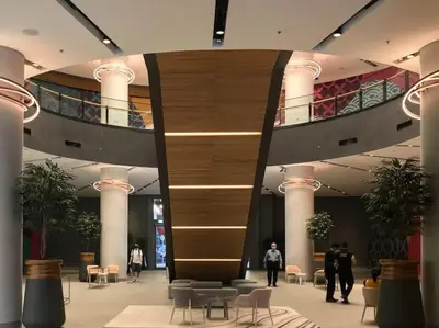 a lobby with people walking in a building at Frank Porter - Mon Reve in Dubai