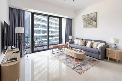 a living room with a couch and a table at Frank Porter - Silverene in Dubai