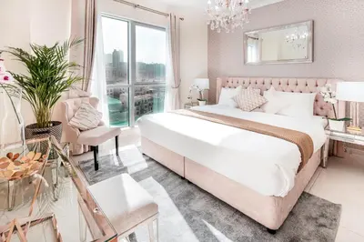 a bedroom with a large bed and a large window at Elite Royal Apartment - Full Burj Khalifa & Fountain View - Brilliant - 2 bedrooms & 1 open bedroom without partition in Dubai