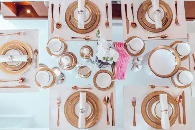 a table with plates and cutlery on it at Elite Royal Apartment - Full Burj Khalifa & Fountain View - Brilliant - 2 bedrooms & 1 open bedroom without partition in Dubai