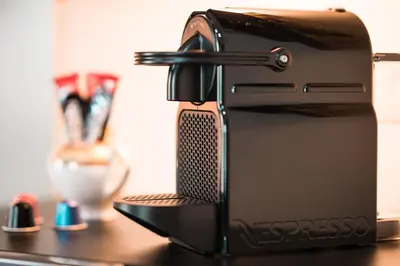 a black toaster sitting on top of a table at Elite Royal Apartment - Full Burj Khalifa & Fountain View - Emerald in Dubai