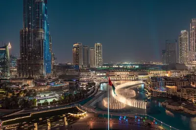 a city skyline at night with tall buildings at Elite Royal Apartment - Full Burj Khalifa & Fountain View - Ruby in Dubai