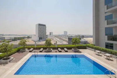 a swimming pool on the roof of a building at Frank Porter - Azizi Aura in Dubai