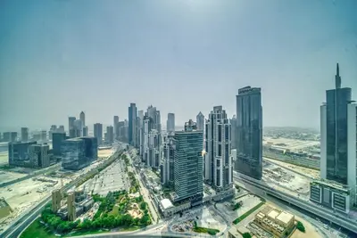 an aerial view of a city with tall buildings at Boho-Chic Cosy 1BR, minutes to Burj Khalifa in Dubai