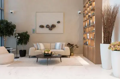a living room with a couch and a coffee table at Elegant Apt With Balcony Minutes from Burj Khalifa in Dubai