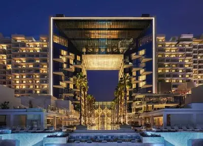 a large building with palm trees in front of it at FIVE Palm Residence - Platinium Dubai in Dubai