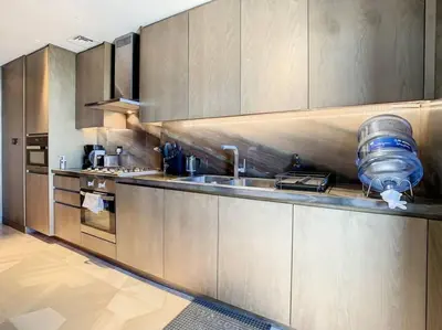 a kitchen with stainless steel cabinets and a sink at FIVE Palm Residence - Platinium Dubai in Dubai