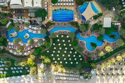 an aerial view of a resort with a pool at The Westin Dubai Mina Seyahi Beach Resort and Waterpark in Dubai